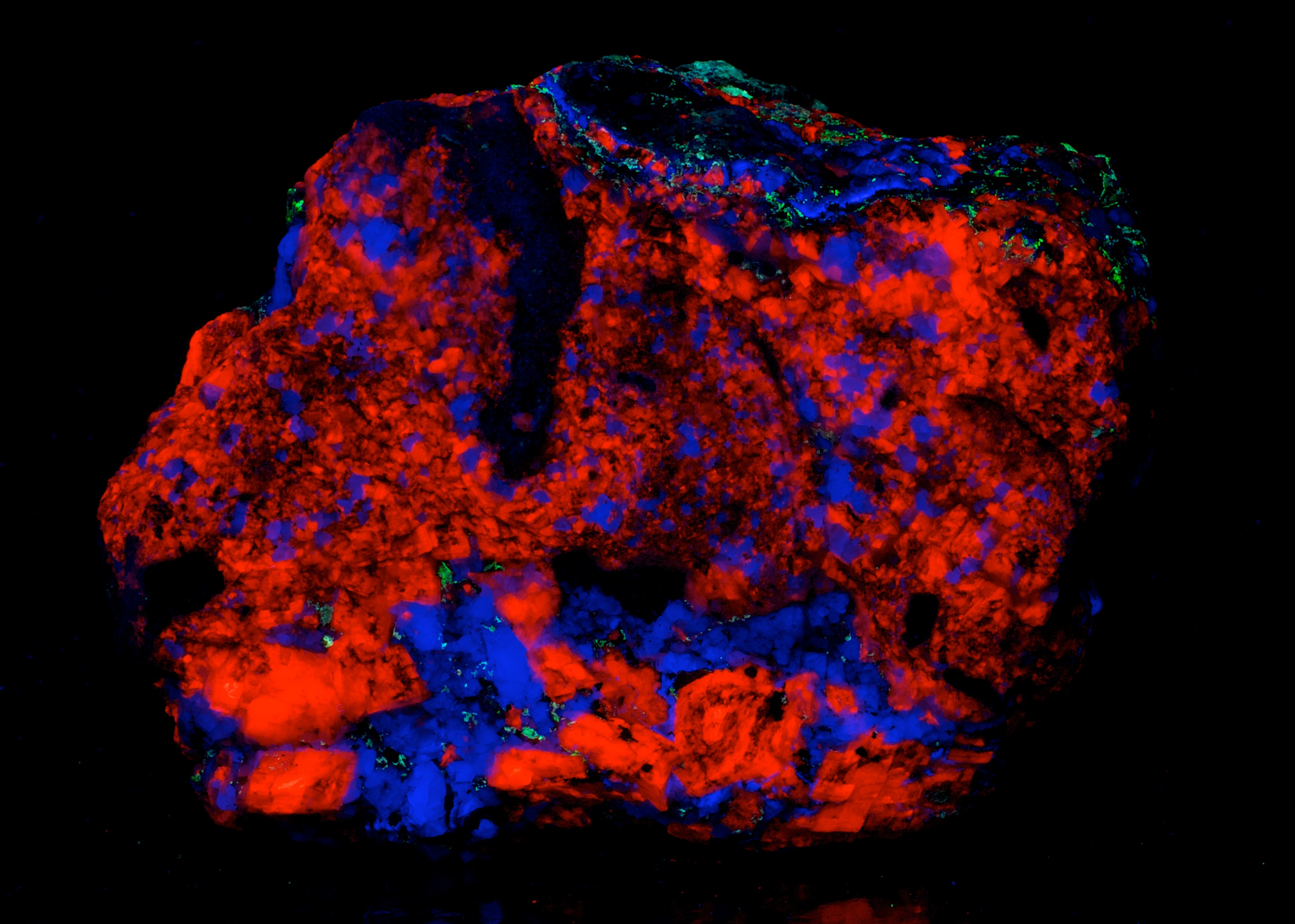 Fluorescence under midwave and shortwave UV light. Side 2.