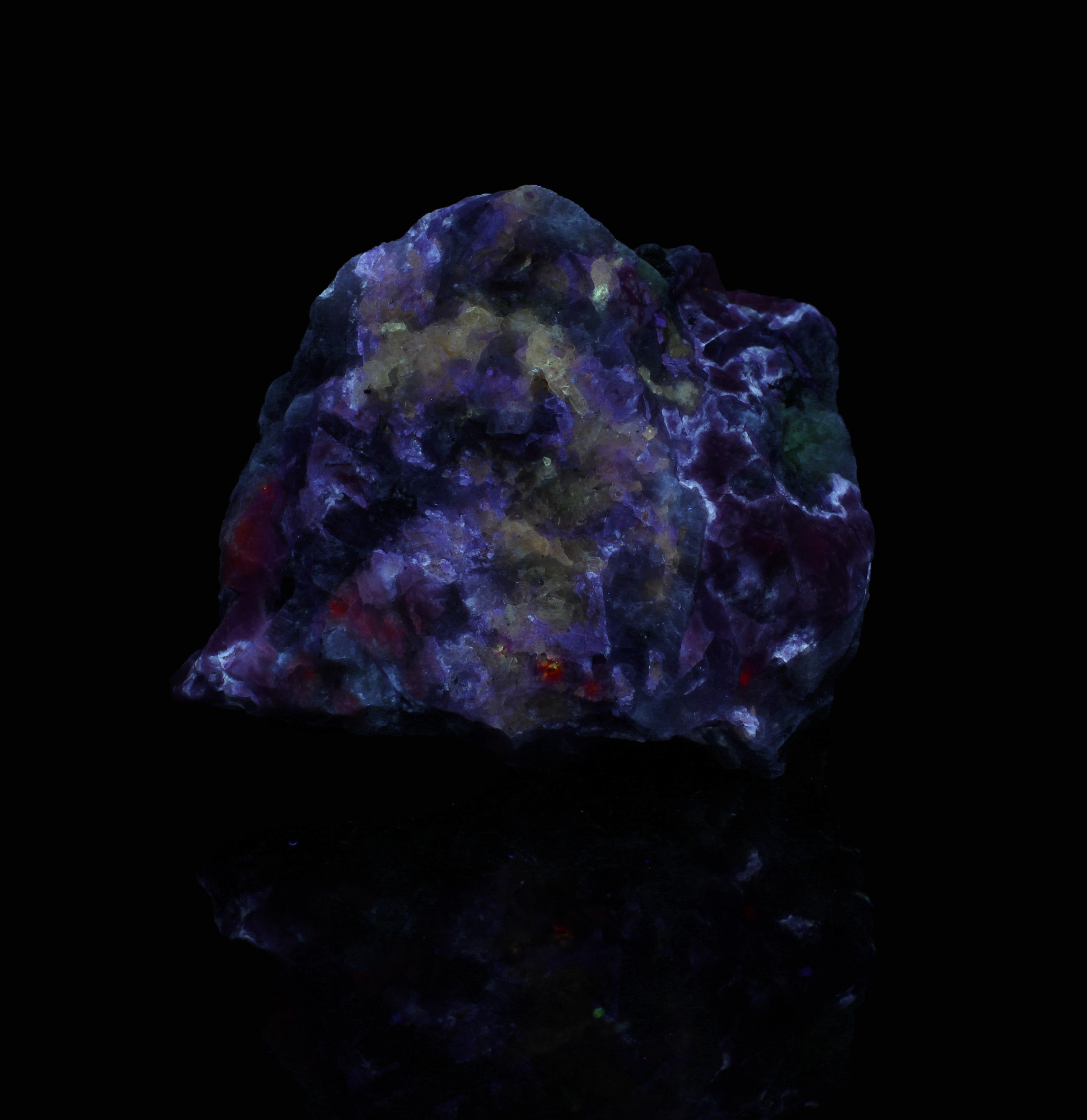 Fluorescence under midwave (302nm tube) UV light. Side 2.