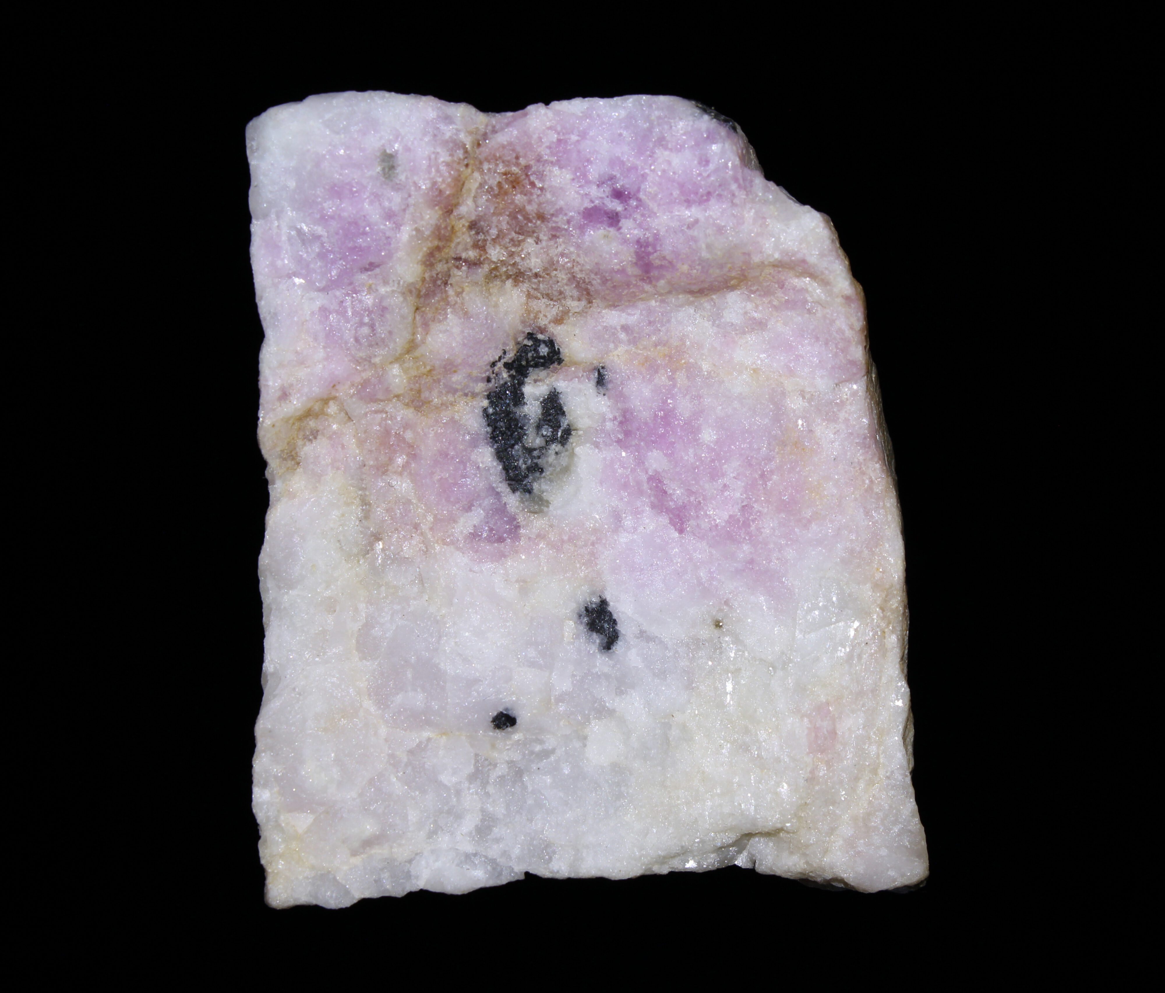Tenebrescence after exposure to longwave UV light.