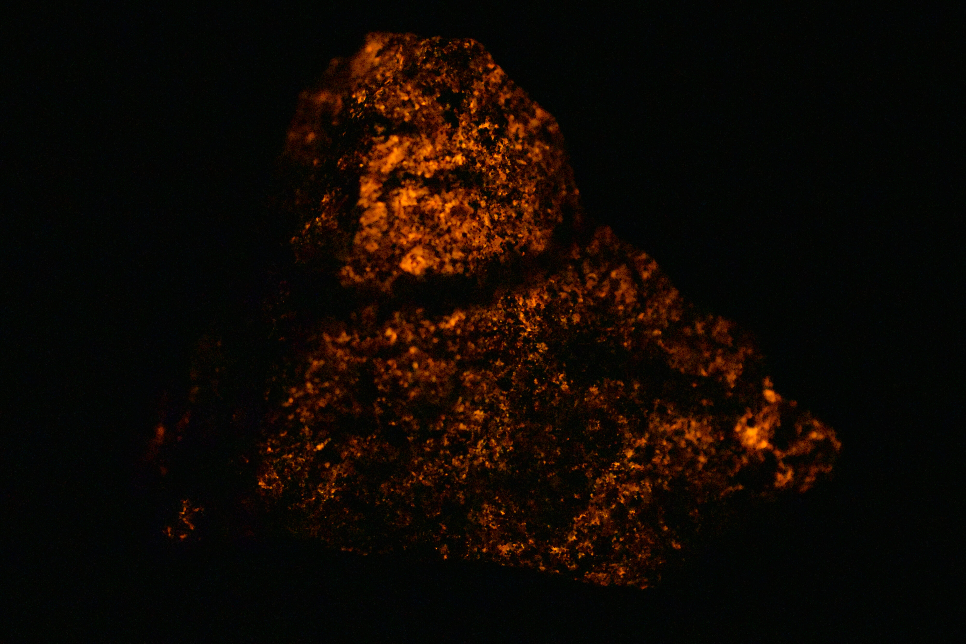Afterglow after exposure to longwave UV light.